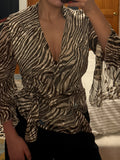 silk-blend sheer zebra wrap blouse